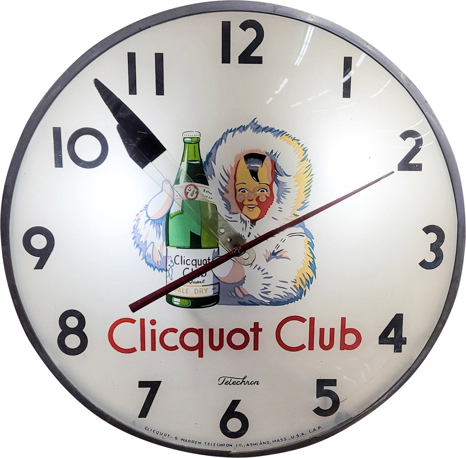 Clicquot Club Light Up Telechron Clock: 15" illuminated working clock in good operating condition features a glass face, aluminum trim, and a masonite can. The trim exhibits slight wear, while the can shows general surface wear, including s