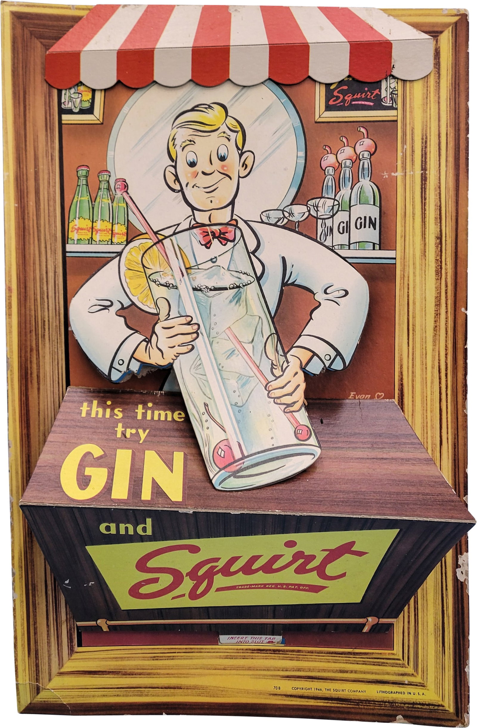1946 This Time Try Gin and Squirt 3D Easel Back Cardboard: 12.25" x 18.5" unusual three dimensional cardboard sign with red and white striped canopy and bartender graphics. There is light wear around the perimeter and the bottom left corner is bent. There are