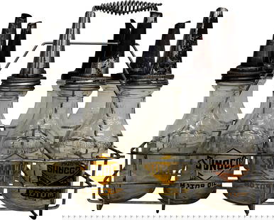 Sunoco Oil Bottles With Carrier: This lot includes eight embossed oil bottles equipped with spouts. Among these, four feature Sunoco logos, with one bottle being in better condition compared to the other three. The metal carrier exhi