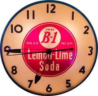 Drink B-1 Lemon Lime Soda Advertising Clock: 15" working illuminated clock with glass face, metal trim, and Masonite can. The clock displays well. There are typical signs of wear on the back side and around the mount hole.