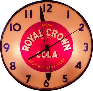 Drink Royal Crown Cola Light Up Telechron Advertising Clock: 15" working illuminated Telechron clock features a glass face and Masonite can. The clock displays well. There is light wear on the metal trim with a couple of small bends at the number 1. The Masonit