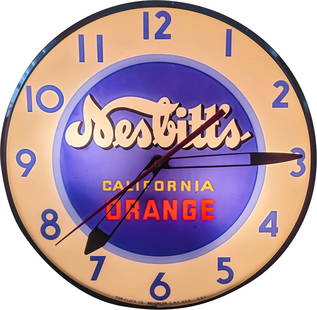 Nesbitt's California Orange Light Up Pam Advertising Clock: 15" working illuminated Pam clock features a glass face and metal housing. The clock looks great and displays very well with light wear on the metal can.