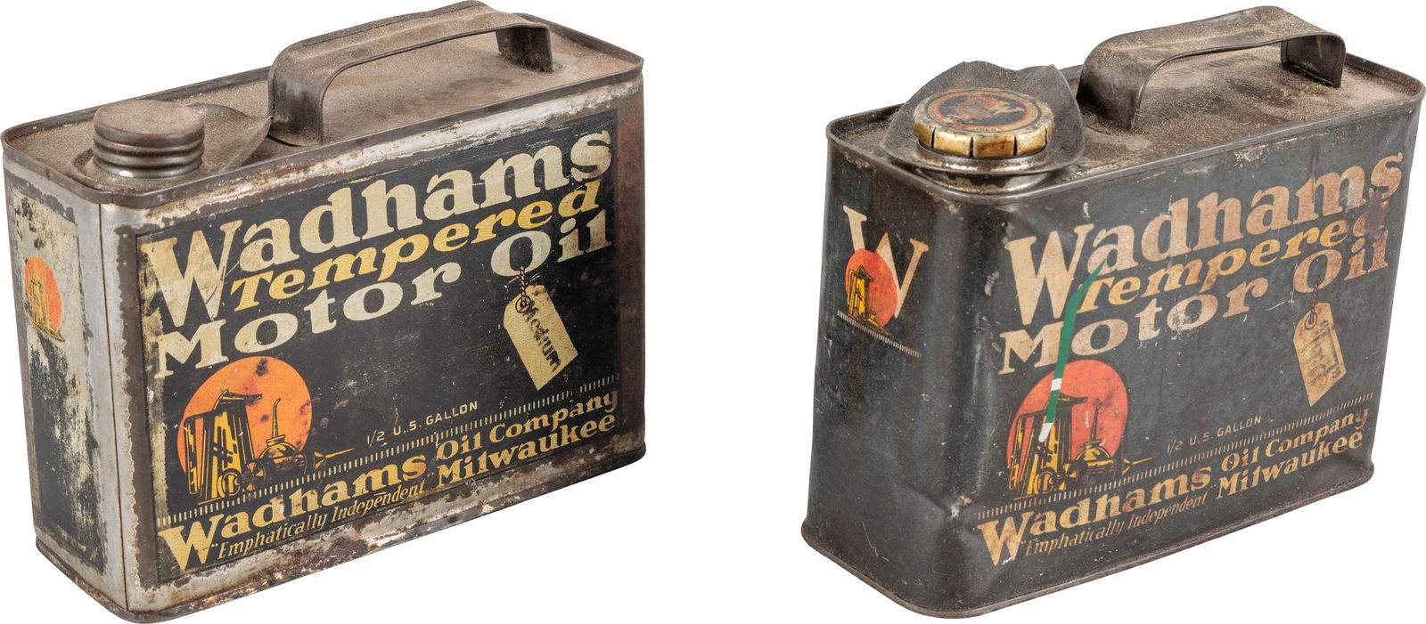Group of Two Metal Wadhams Tempered Motor Oil Half Gallon Cans: Group of two empty metal half gallon oil cans. The cans have good color with moderate shine. Both have areas of wear with dents, scratches areas of paint loss, and one can has errant paint on two side