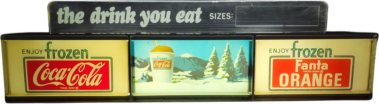 Frozen Coca Cola Frozen Fanta Orange Light Up Sign: 15" x 5" x 4" illuminated working sign is in great shape, showcasing a plastic front with chrome accents and a metal casing. It shows minimal signs of wear. The clear plastic sign on top displays the