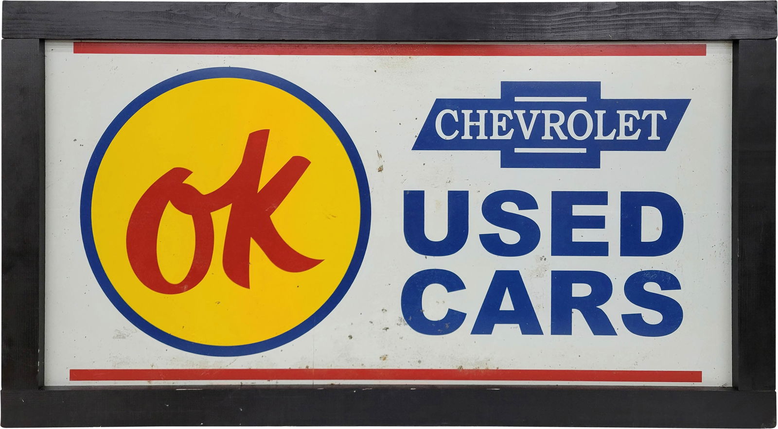 Chevrolet OK Used Cars Single Sided Tin Sign In Frame: 28" x 50.5" SST sign has general wear throughout with scuffs, scratches, and stains. The wood frame is in excellent condition and there are 2 hangers installed at the top edge. AGE UNKNOWN.