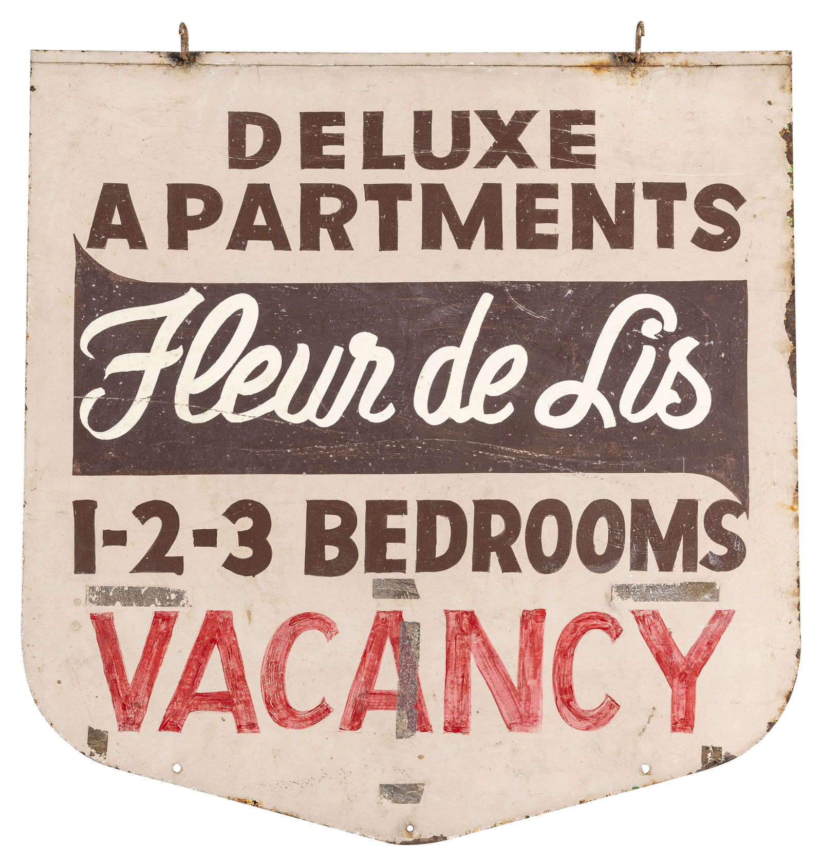 Deluxe Apartments Fleur de Lis Vacancy: 30" x 31" DST sign exhibits wear throughout each side with scratches, dirt, stains, flaked paint, and a bend on the bottom tip.