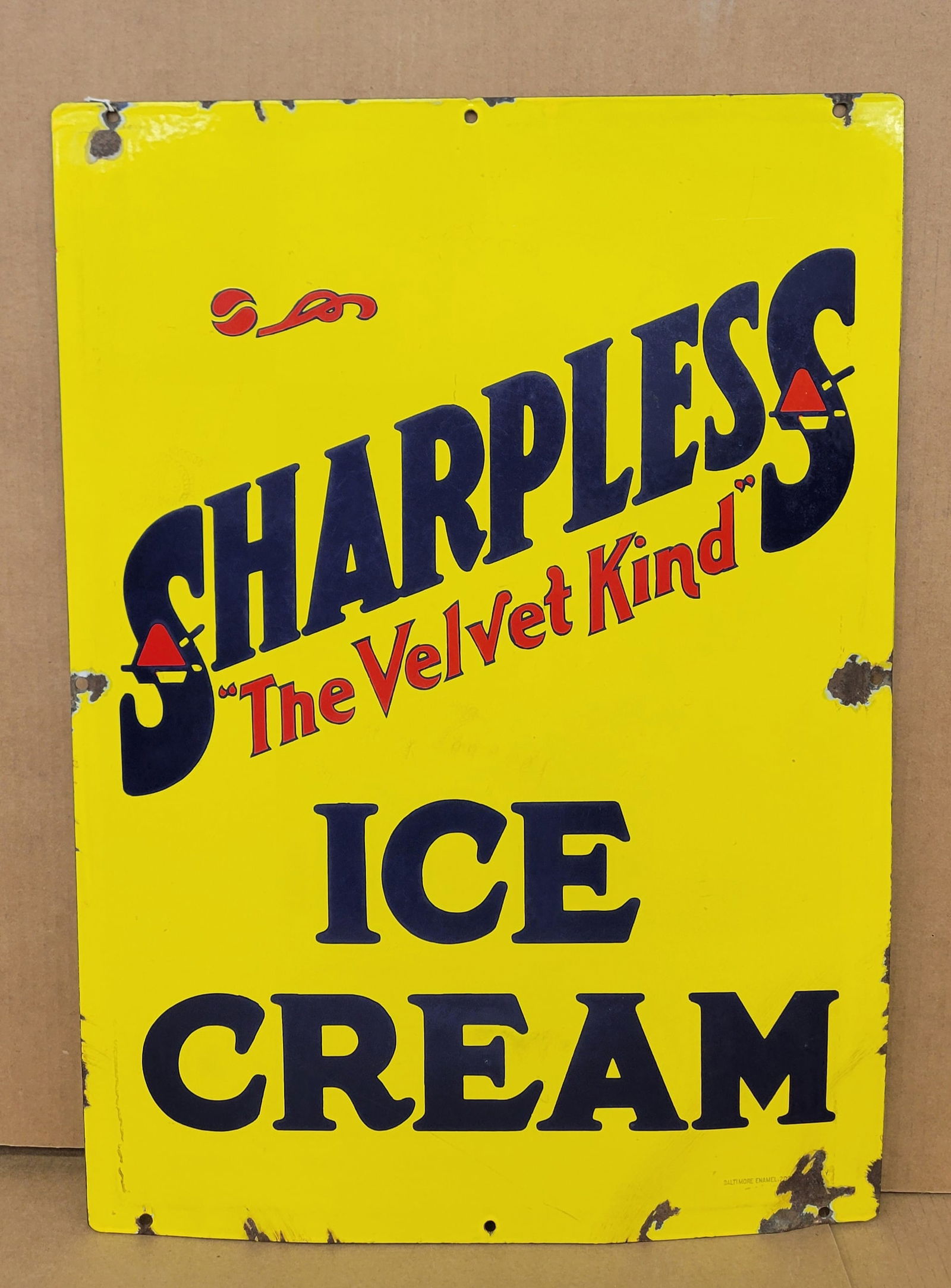 Sharples The Velvet Kind Ice Cream Double Sided Porcelain Sign: 20" x 28" DSP ice cream sign displays bright color and good gloss on each side. One side has a small area in the center field with light circular scratches. The perimeter of each side has small chips