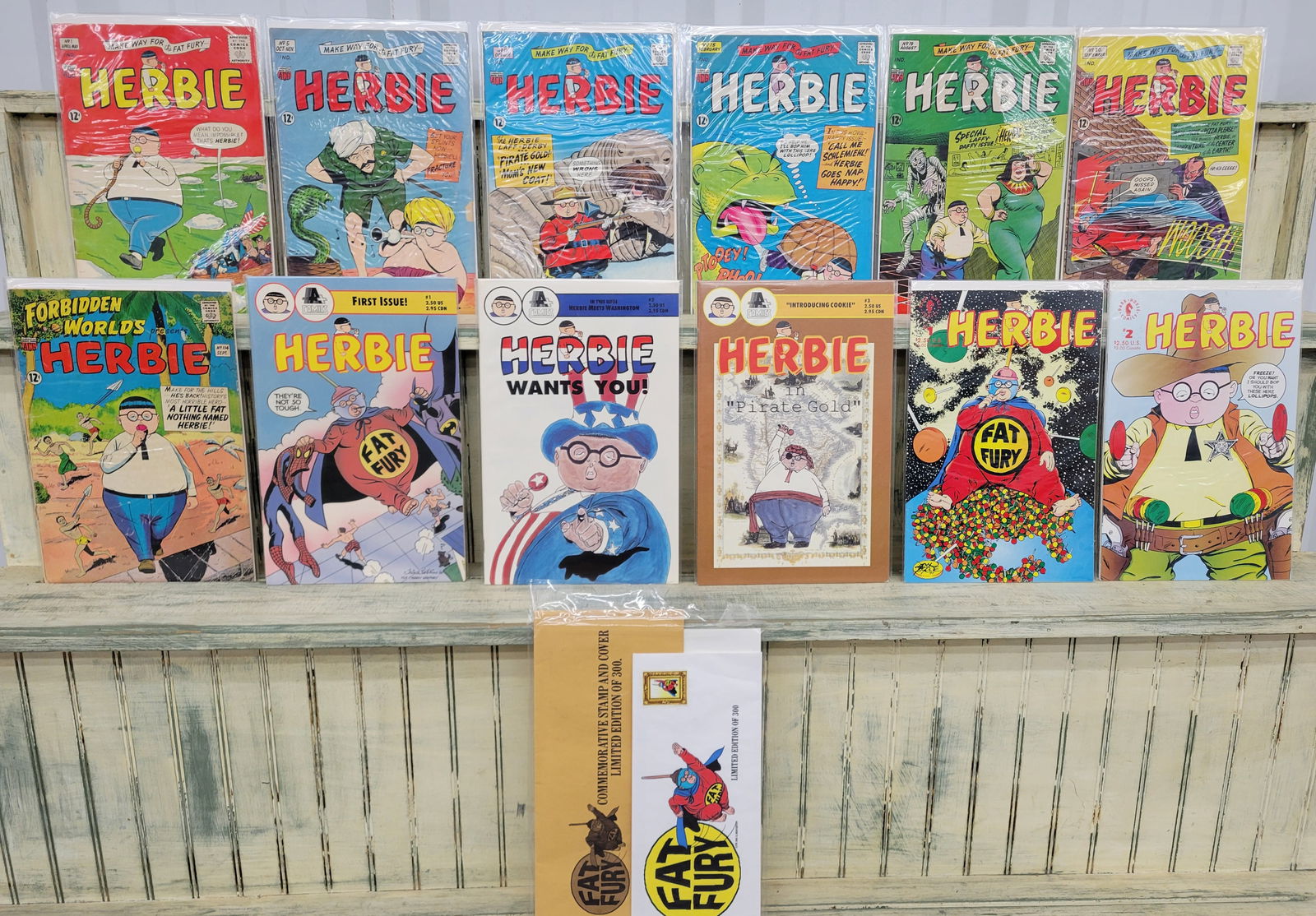 Herbie Silver and Modern age comic books with scarce Commemorative Stamp and Cover: Lot of 12 comic books and a Fat Fury commemorative stamp. The comic books include 7 silver age comics from American Comic Group. Six comics are Herbie including #1, 5, 13, 15, 19, and 20. Also from AC