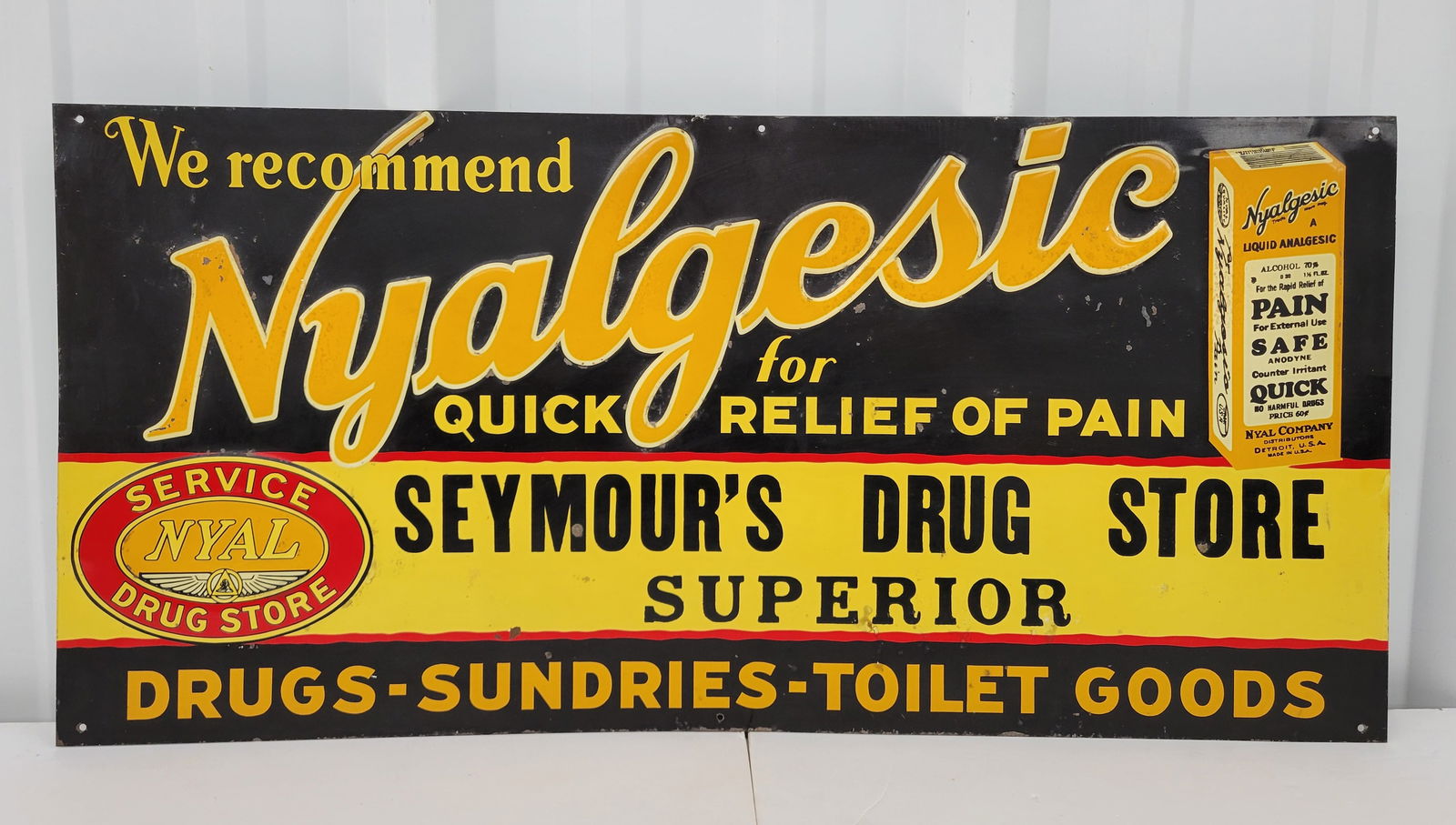 Seymour's Drug Store Embossed Nyalgesic Tin Sign (1 of 2)