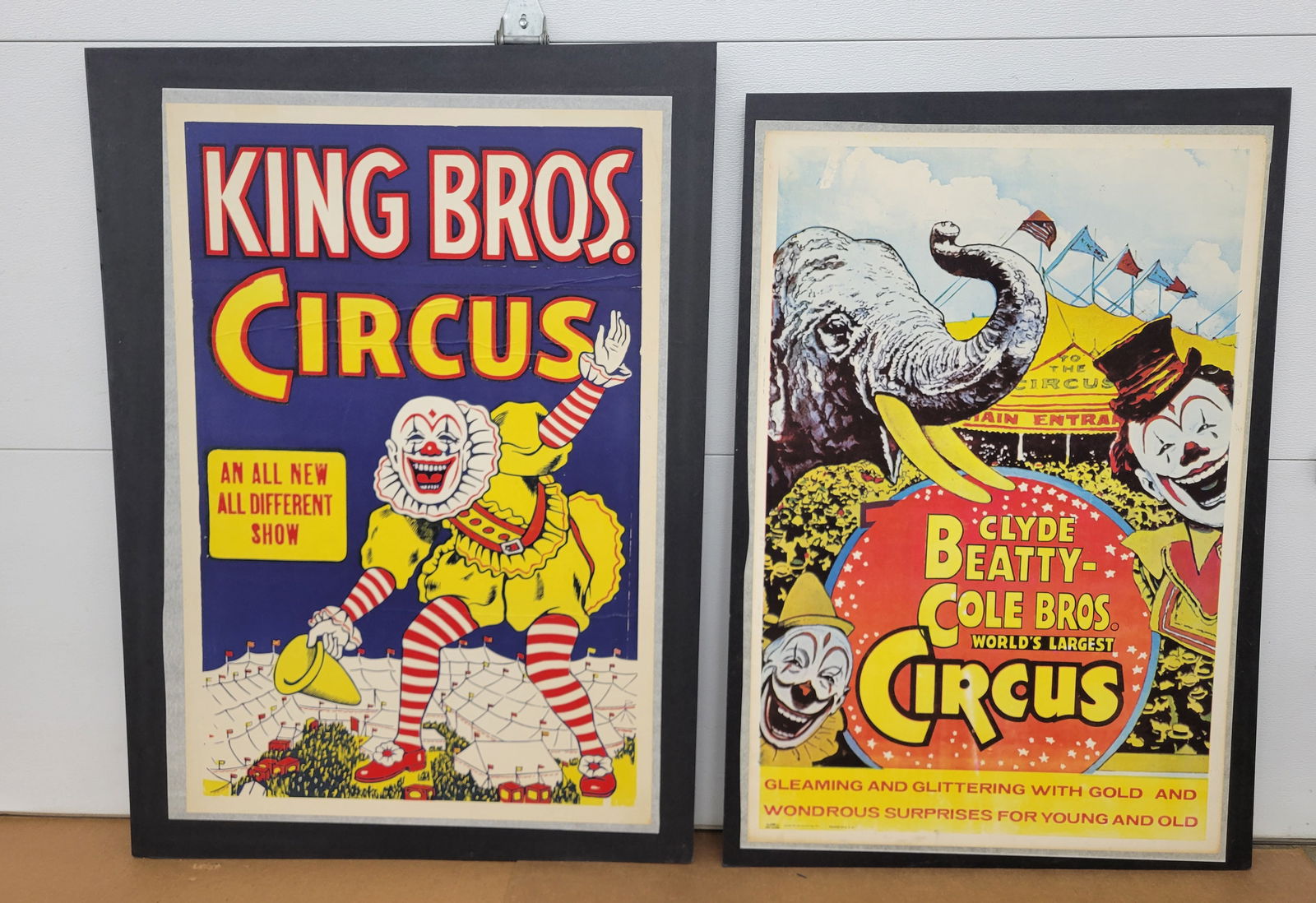 Clyde Beatty - Cole Bros. and King Bros. Circus Posters: Lot of 2 posters professionally mounted on foam board includes a 30.5" x 45.75" Clyde Beatty - Cola Bros. Circus poster in very good condition with bright colors and minor scuffs. The other King Bros.