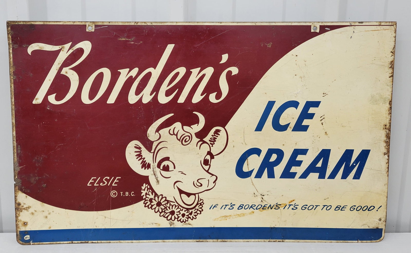Borden's Ice Cream Double Sided Tin Sign With Elsie: 30" x 18" DST sign features Elsie the cow. The sign has general wear throughout each side with scratches, edge wear, and light rust along the perimeter. There is bullet ding near the lower edge.