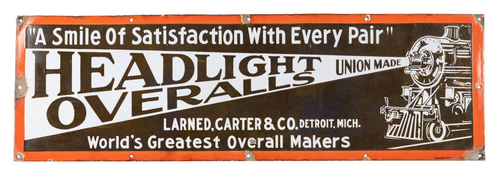 Headlight Overalls "A Smile of Satisfaction with Every Pair" 4' SSP Sign w/ Train: 12" x 48", SSP sign has good color and gloss. The display has light surface wear and the blue porcelain enamel has darkened over the years. The perimeter has small chips along the edges and mounting h