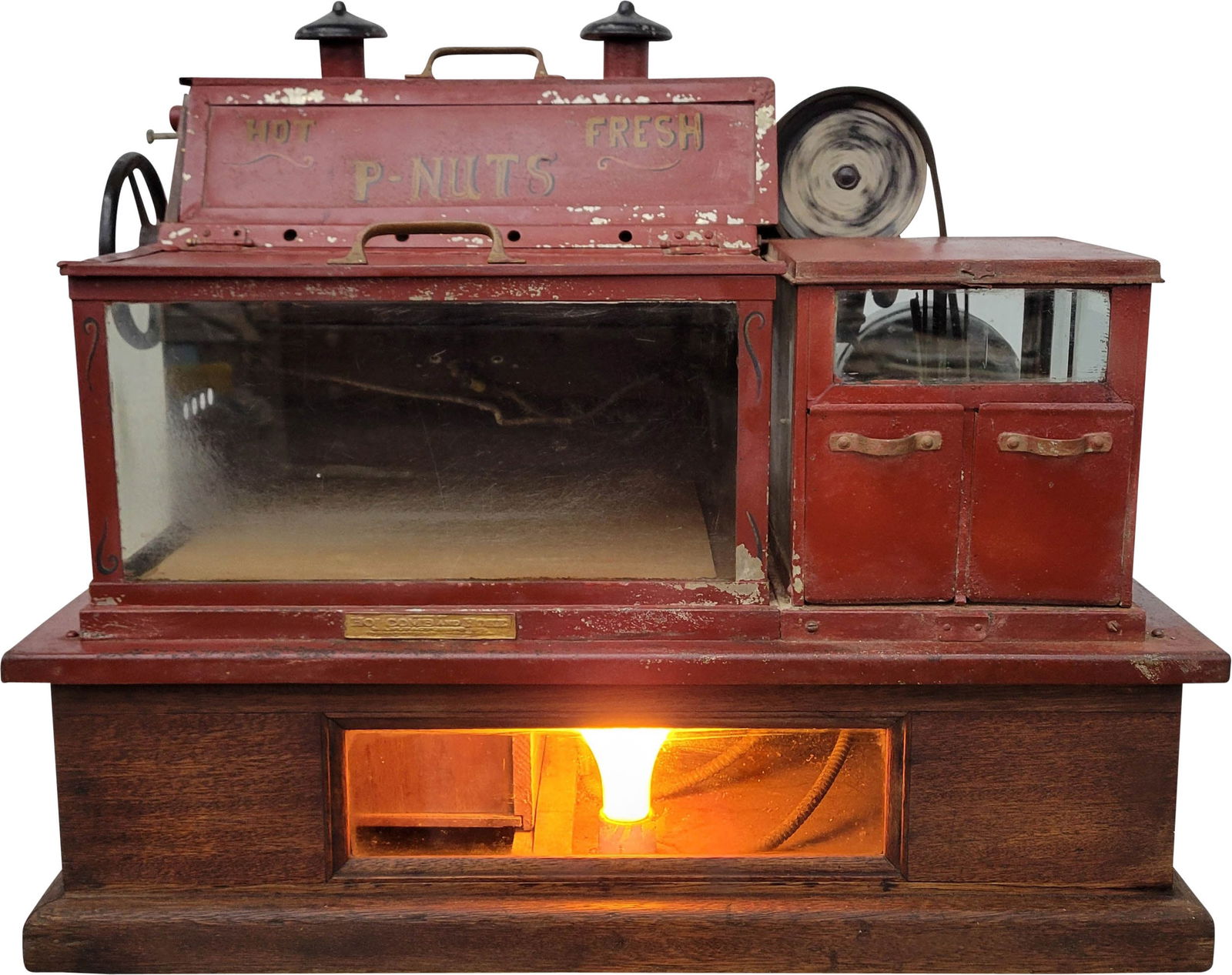 1920's Holcomb and Hoke Butter Kist Toasted Peanut Vendor Machine: 1920's counter top peanut roasting machine features a metal housing, glass display area, and a wood base. The machine is in original condition with normal age related wear. It has not been tested. But