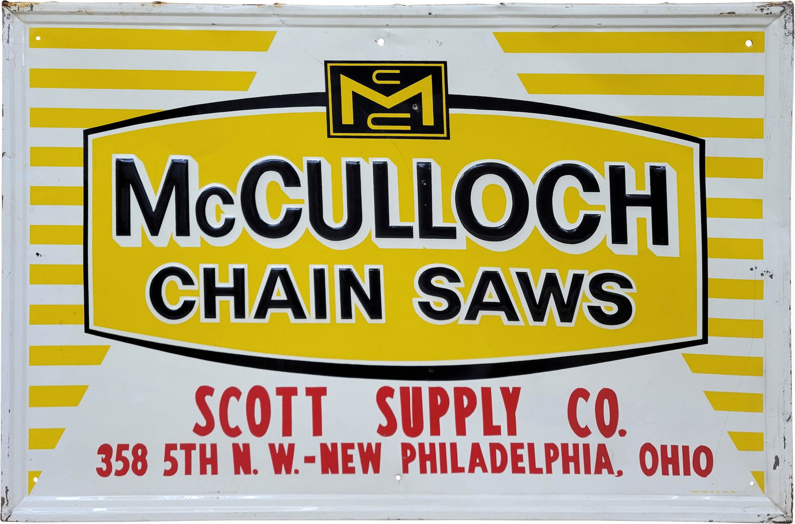 McCulloch Chain Saws Embossed Single Sided Tin Sign: 34" x 22.25" embossed SST sign exhibits good and shine. There are several bends in the field with 2 non factory holes and light scratches. The perimeter shows wear with flaked paint, stains, and bends