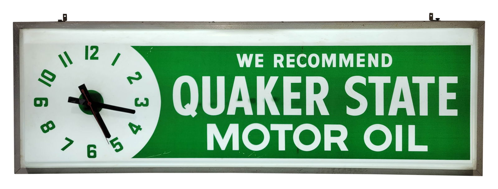 Quaker State Motor Oil Light Up Clock Advertising Sign: 73" x 25" x 8" working illuminated clock sign has a plastic face that features bright colors. It shows light signs of wear, including small scratches and some dirt. The metal can exhibits usual wear.