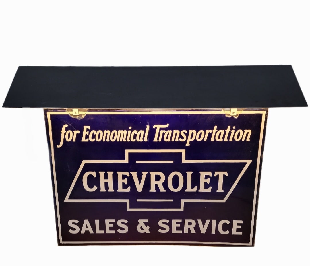 Chevrolet Sales And Service For Economical Transportation DSP Sign With Hood TAC: 40" x 28" DSP sign exhibits high gloss and excellent colors throughout both sides. The mounting holes at the top edge have chips that have been color matched on each side. The perimeter has light wear