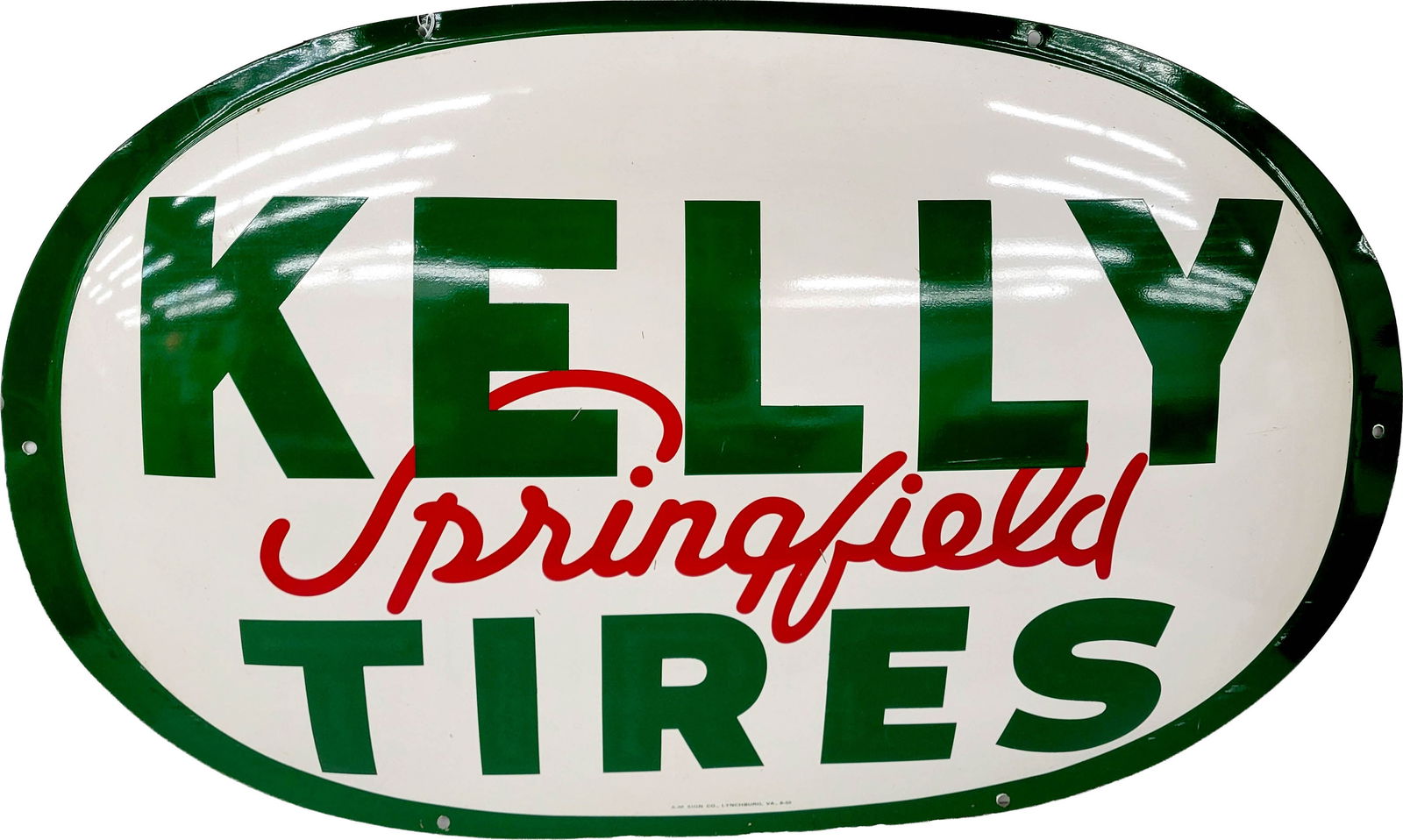Kelly Springfield Tires Single Sided Tin Dome Sign: 36" x 22" SST convex sign displays well with bright colors and high shine. There are a few small minor scratches in the field with a minor ding at the top edge near the mounting hole. A-M Sign Co. 9-5