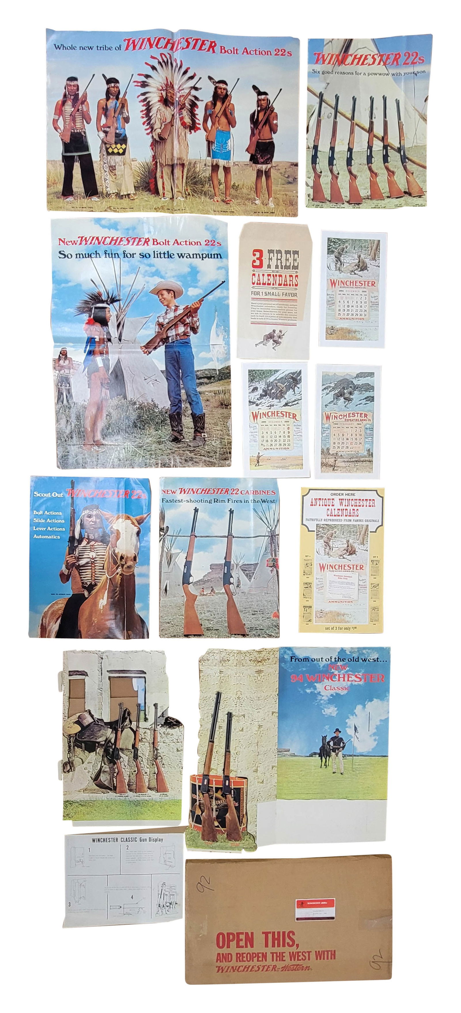 1965 NOS Winchester Gun Display Kit: 1965 marketing kit includes multiple posters, calendars, and cardboard stand up displays. The kit is in overall very good condition. One of the horizontal posters has stains along the bottom and edge