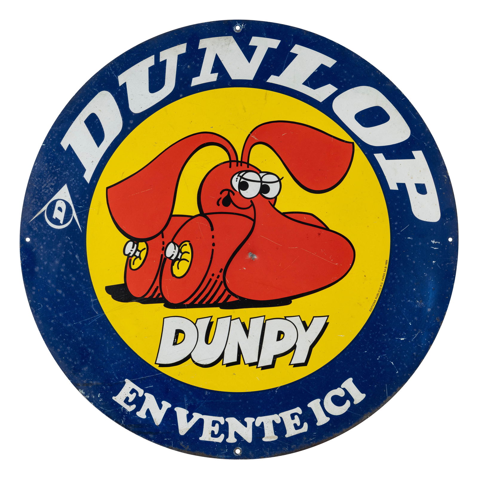 Dunlop Tires 28" DST Sign w/ "Dunpy" Logo: 27.5" D., DST sign has good color and shine. Side #1 has a small ding with a paint chip in the "Dunpy" graphic, fine scratches and other surface imperfections. The reverse is in a similar condition wi