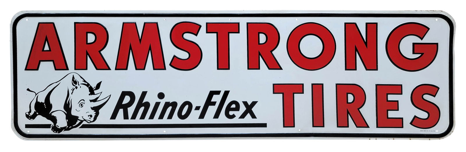 Armstrong Rhino Flex Tires Embossed Single Sided Tin Sign: 60" x 18" embossed SST sign displays good color and shine with light wear in the field including scuffs and light scratches. The perimeter shows light wear with several small bends and stains. Stout S