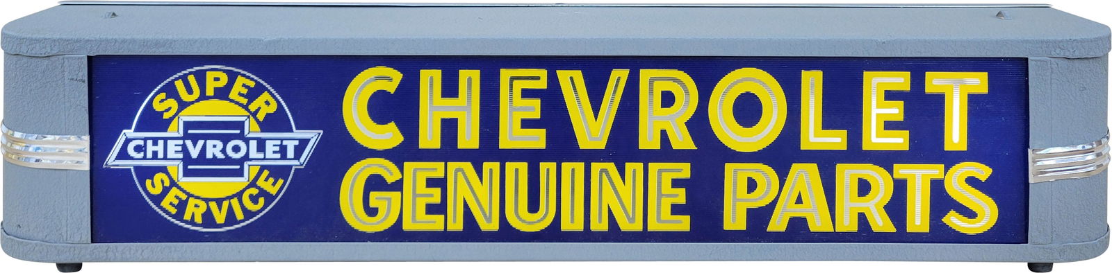 Chevrolet Genuine Parts Light Up Advertising Sign: 27" x 4.25" x 5.25" light up sign features a new ribbed glass face with the Chevrolet Super Service logo. The can has been repainted and new chrome accent trim pieces have been attached on each end.