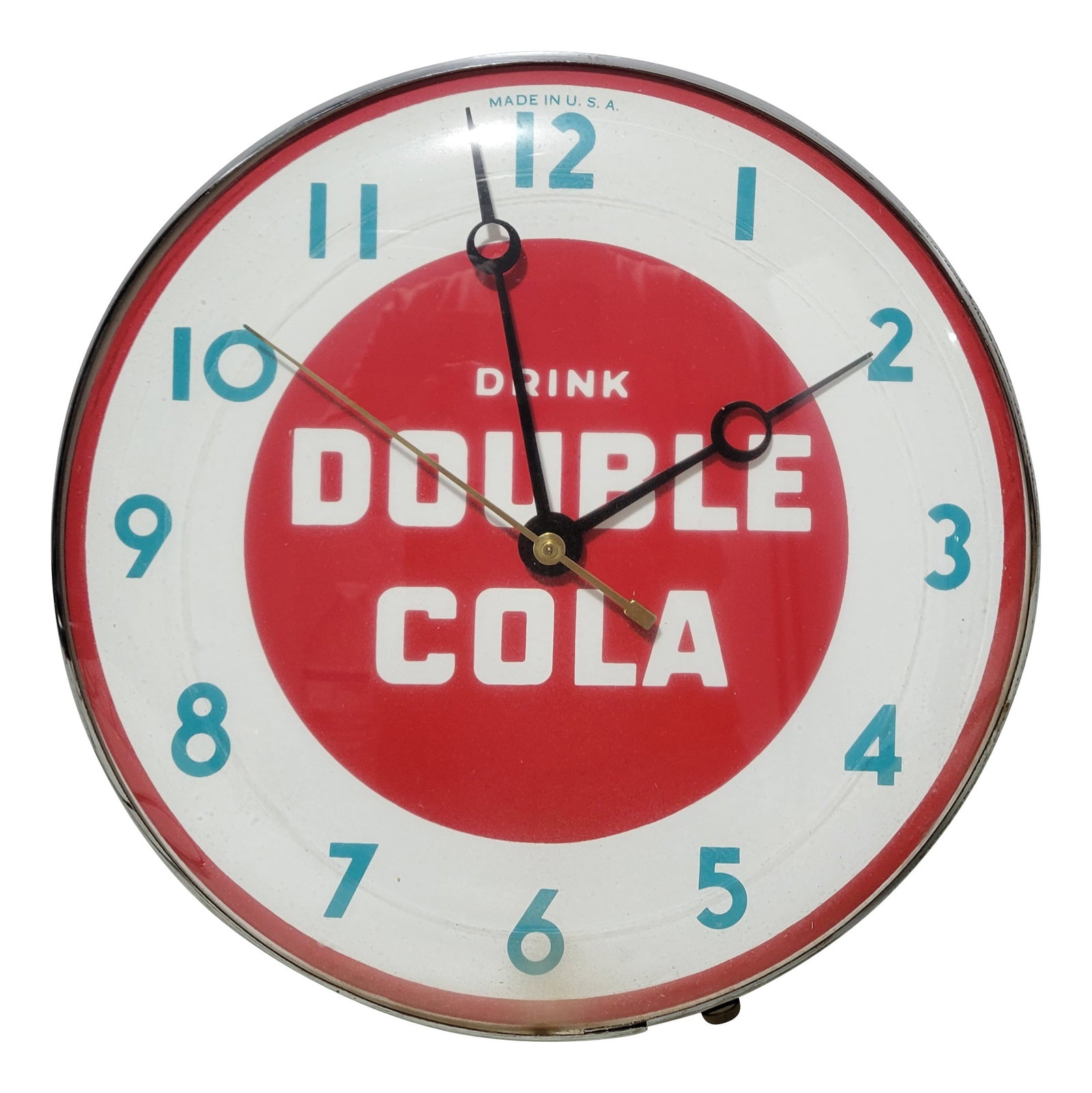 Drink Double Cola Advertising Clock: 12" working clock features a glass face and shiny chrome trim. The clock displays well with bright colors. The glass face has minor dust on the inside.