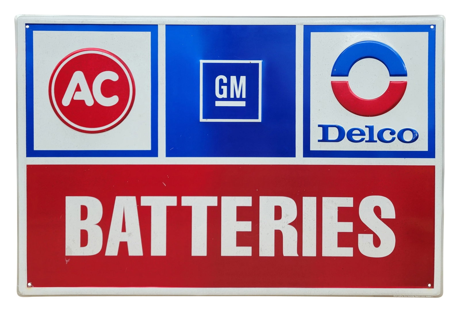 Ac Delco GM Batteries Embossed SST Sign: 36" x 24" embossed SST sign is in very good condition with bright colors and high shine. There are faint stains and a few scuffs in the field.