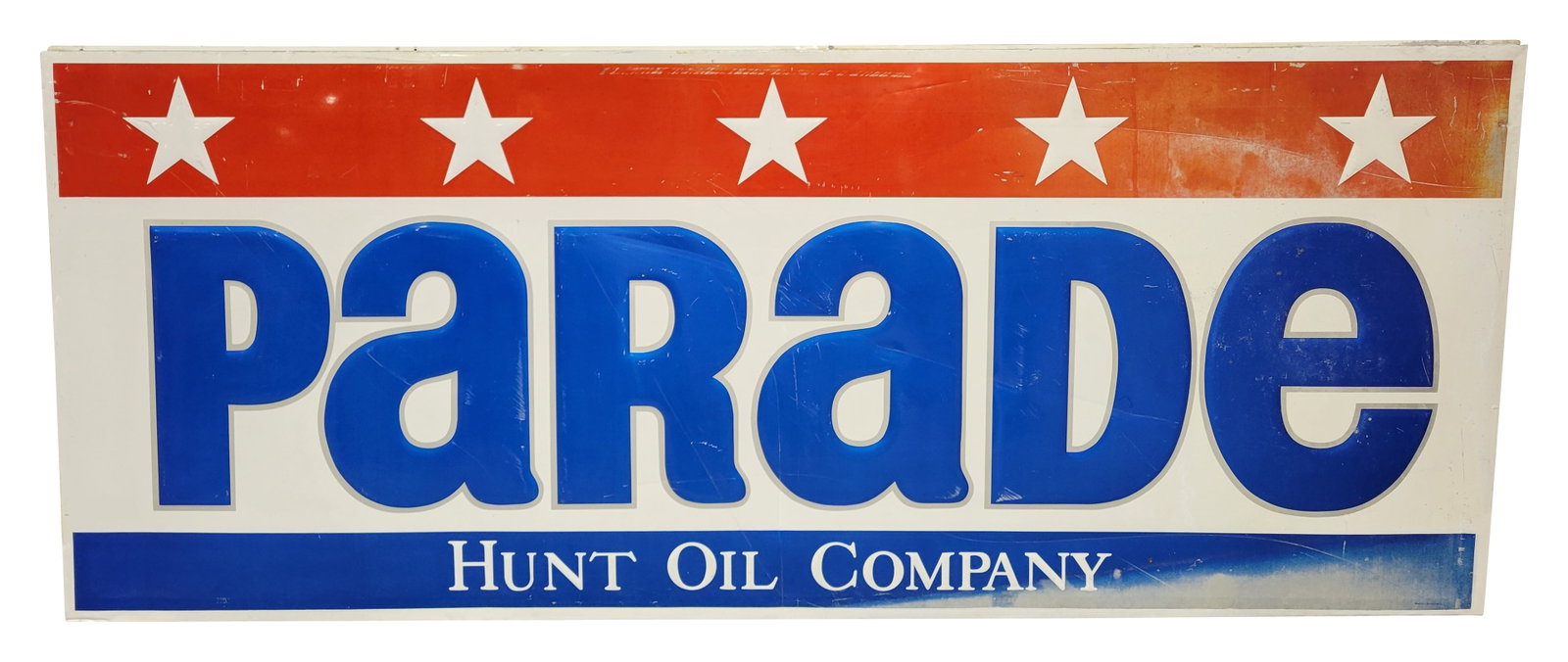 Large Parade Hunt Oil Company Embossed SST Sign: 112" x 44.5" large embossed single sided tin sign displays general wear throughout with fading, scratches, and several small dings. The sign is mounted to a wood frame. Stout Lite by Stout Sign Co.