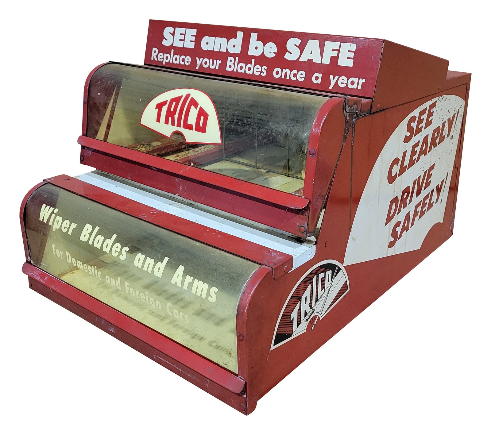 Trico Wiper Blades and Arms Countertop Display Vendor: 14" x 19.5" x 12" metal vending display includes 2 flip-up plastic display windows and 2 compartments. The plastic windows have discoloration. The metal cabinet exhibits standard wear, including
