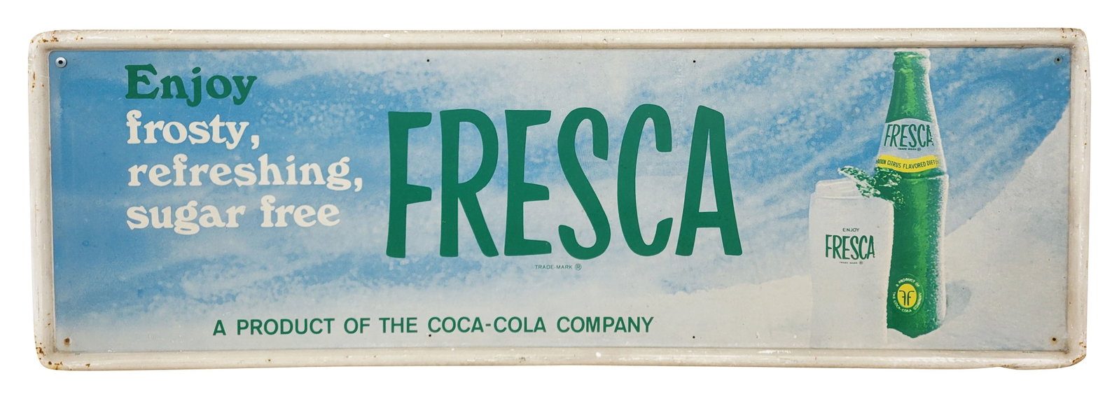 Enjoy Fresca Single Sided Tin Sign: 54" x 18" SST sign displays good color with light wear throughout including light scuffs and scratches in the field. The self framed perimeter exhibits wear with scratches, errant paint, and surface r