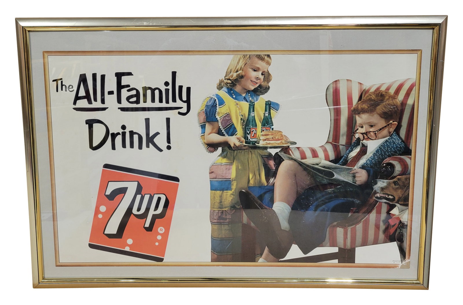 1953 All Family Drink 7Up Framed Cardboard Sign: 38" x 26" cardboard is displayed under glass within a metal frame. The cardboard has good color with minor surface wear in the field. The lower right corner has a small missing section of paper. The m