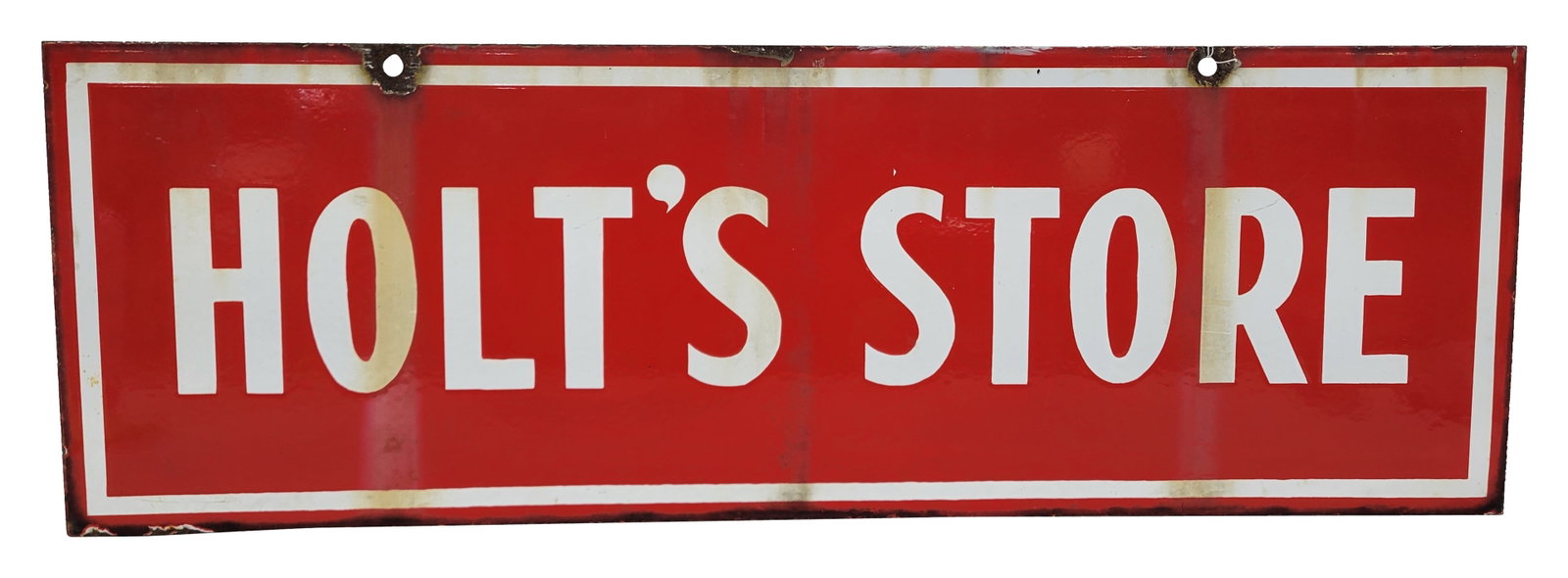 Holt's Store Double Sided Porcelain Sign: 36" x 12" DSP sign displays bright color and high gloss on each side with drip stains. There is wear along the perimeter with chips at the mounting holes on each side.