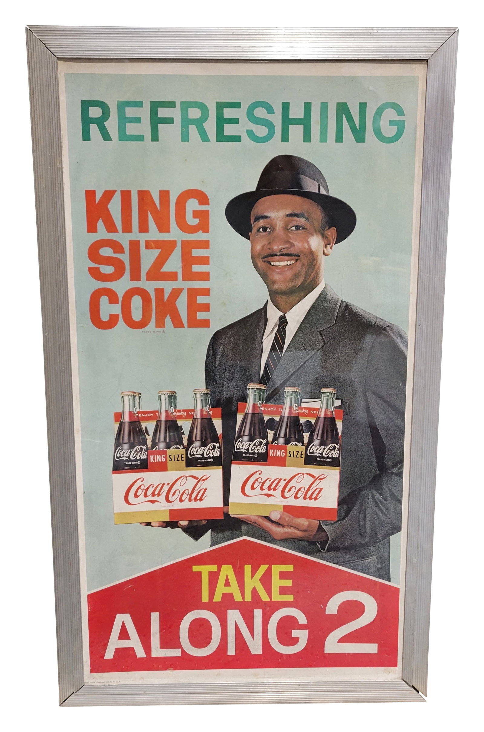 Refreshing King Size Coke Cardboard Sign In Aluminum Frame: 22" x 39" Take Along 2 Coca Cola cardboard has an aluminum frame with plexiglass. The cardboard is in good condition with good color and minor marks on the surface. There is a shallow crease along the