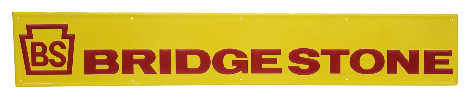 BS Bridgestone Embossed Single Sided Tin Sign: 72" x 12" horizontal embossed SST sign displays good color and moderate shine with light wear in the field. There are a few very shallow minor bends along the self framed perimeter with minimal wear.�