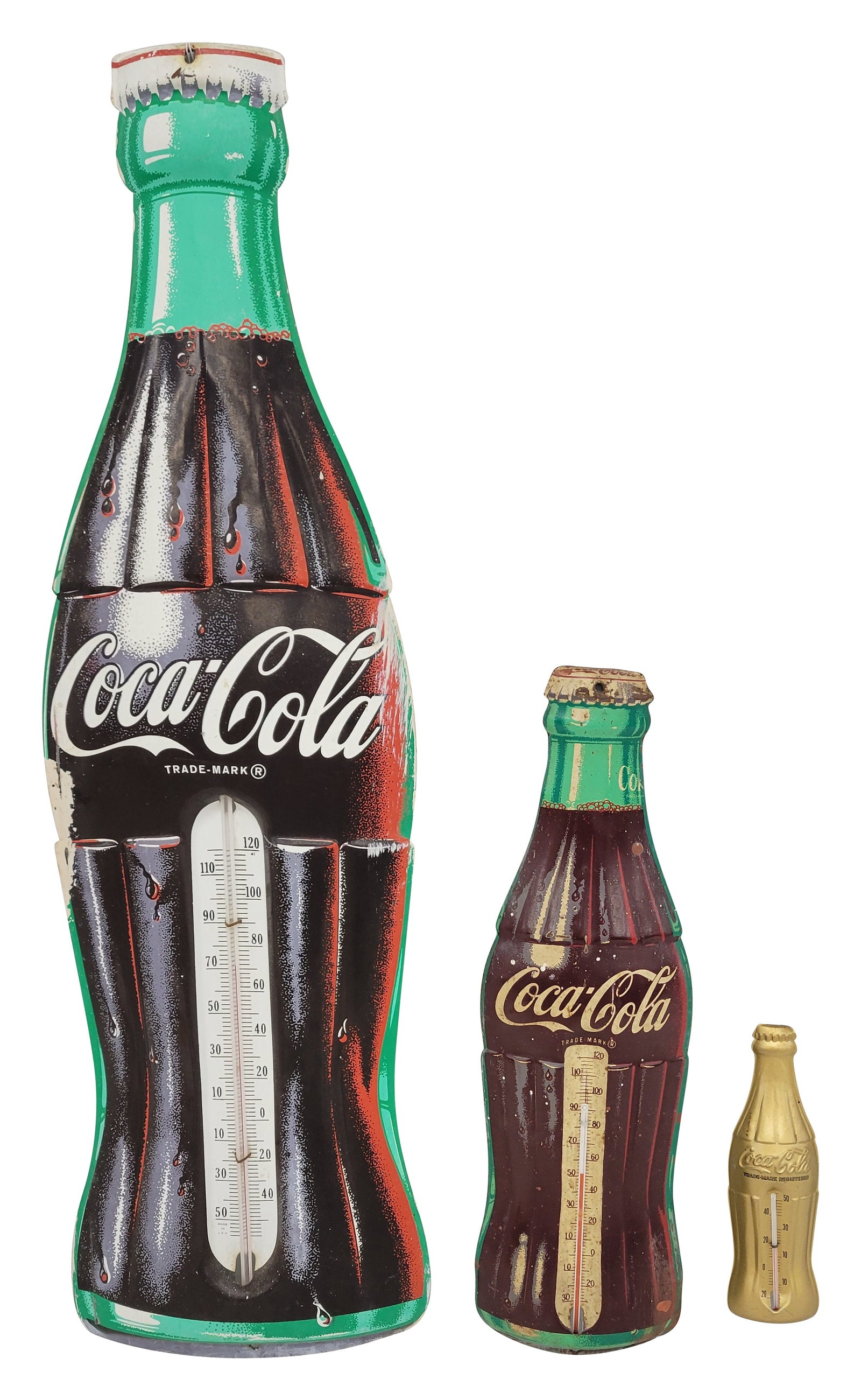 Coca Cola Tin Die Cut Bottle Thermometer Signs: Lot of 3 includes a 2.25" x 7" gold bottle thermometer in very good condition and a 5" x 16" Robertson thermometer with moderate wear and white paint specks. It appears to read low. The third is a wor