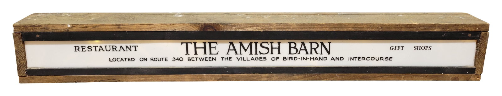 The Amish Barn Light Up Sign: 47" x 6.5" x 4" working illuminated sign features a plastic face and custom wood cabinet. The face has minor wear and the cabinet is in good condition.