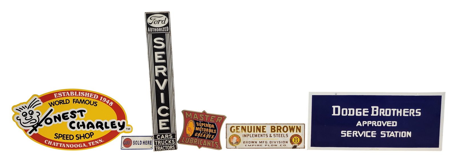 Genuine Brown Implements DSP Sign and Misc. Signs: Lot of 6 includes an 24" x 8" DSP Genuine Brown Implements and Steels sign that displays moderate wear on one side with scratches, stains, and chips along the perimeter. The reverse presents better wi