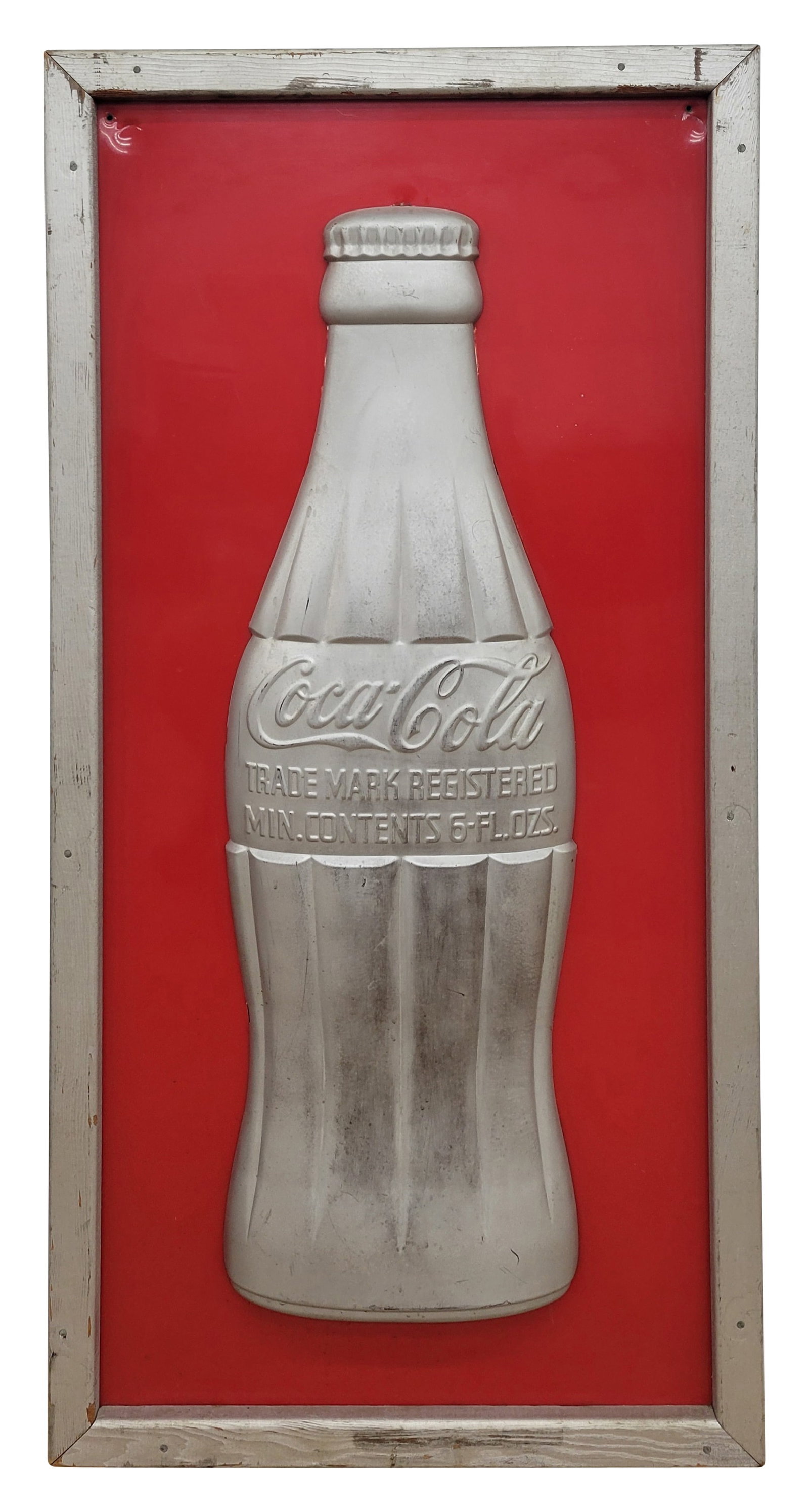 Coca Cola 3D Embossed Bottle Sign: 24" x 48" sign features a tin silver colored bottle against a red background within a painted silver wood frame. The bottle is in excellent condition. The wood frame has wear with scratches and flaked