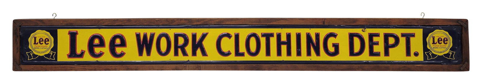 Lee Clothing Dept. Embossed Single Sided Tin Sign In Frame: 62.25" x 7.25" embossed horizontal SST sign is secured with small nails within a rustic wood frame. The sign exhibits bright colors and good shine with some wear in the field including scuffs and smal
