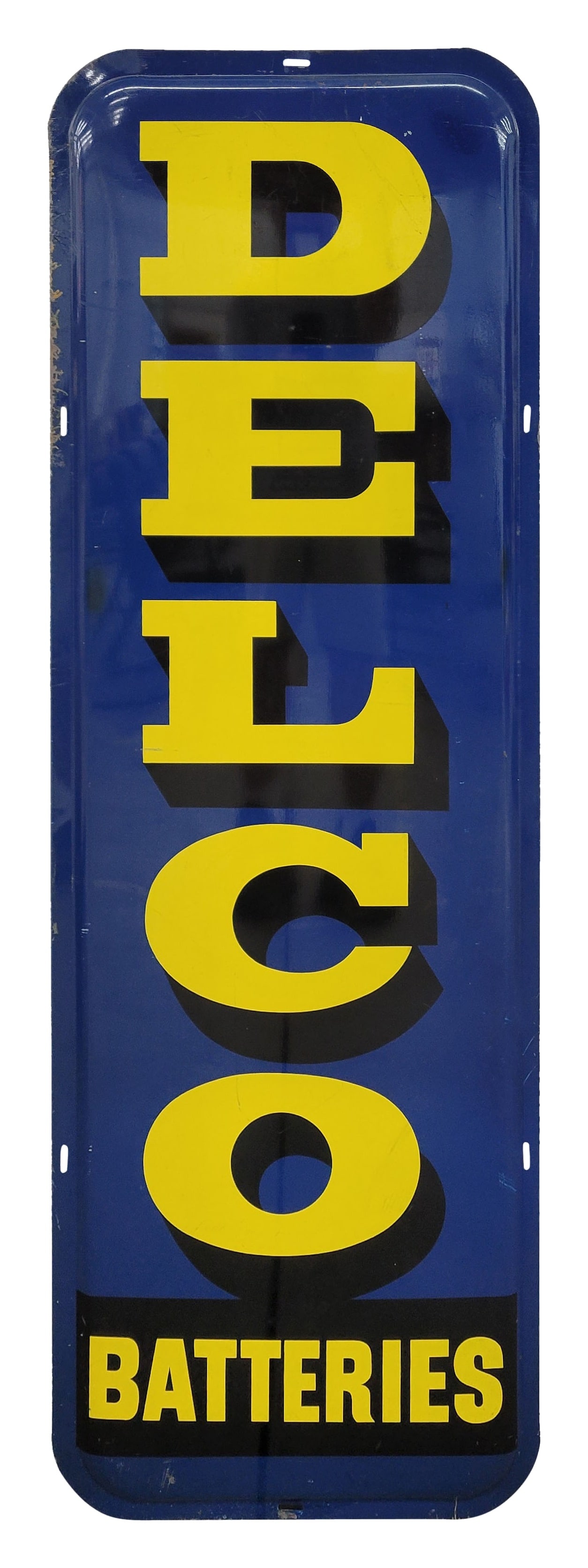 Delco Batteries Single Sided Tin Sign: 20" x 60" SST sign showcases bright colors and good shine. The field shows light wear, including scuffs and scratches, and there is a repainted section along the right edge near the lettering. The per
