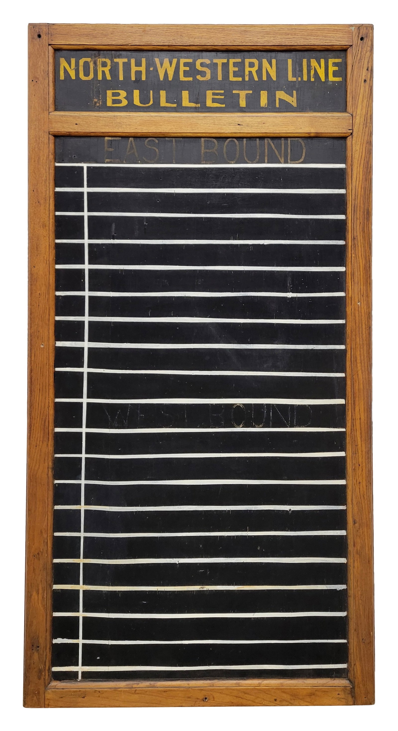 North Western Line Railroad Bulletin Board Sign: 34" x 67" painted composite bulletin board is framed in wood. The surface exhibits signs of age with minor cracking in the field. The original wood frame has normal signs of age and wear with several 