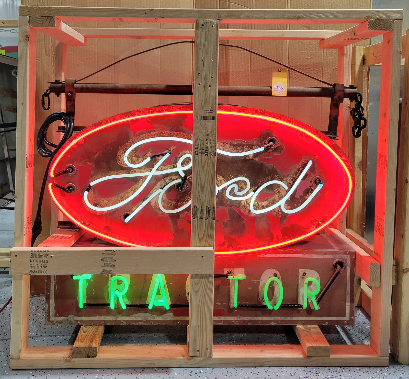 Ford Tractors 48" DST Factory Neon Sign: 44" x 48" x 8", DST factory neon sign with the original metal can with hangers. The sign presents with general wear throughout with paint chips, oxidation and wear. The can and hangers are in good con