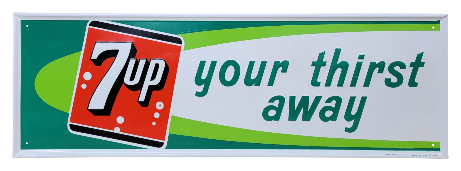 7Up Your Thirst Away Embossed Single Sided Tin Sign: 45" x 15" SST embossed sign displays well with strong colors and good shine. There are small minor factory flaws on the surface and faint discoloration in the white area above the words "your thirst"