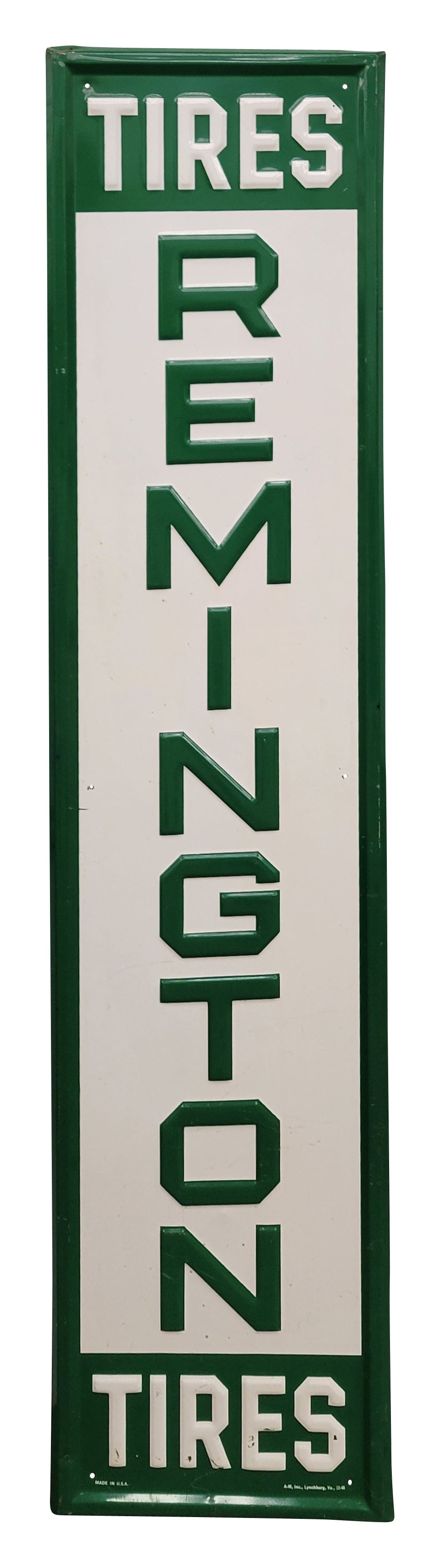 Remington Tires Embossed Single Sided Tin Sign: 13.5" x 59.5" vertical self framed embossed SST sign displays good color and shine with small scuffs and scratches in the field. The perimeter has minor wear with a few minor bends. A-M Inc. 10-66.