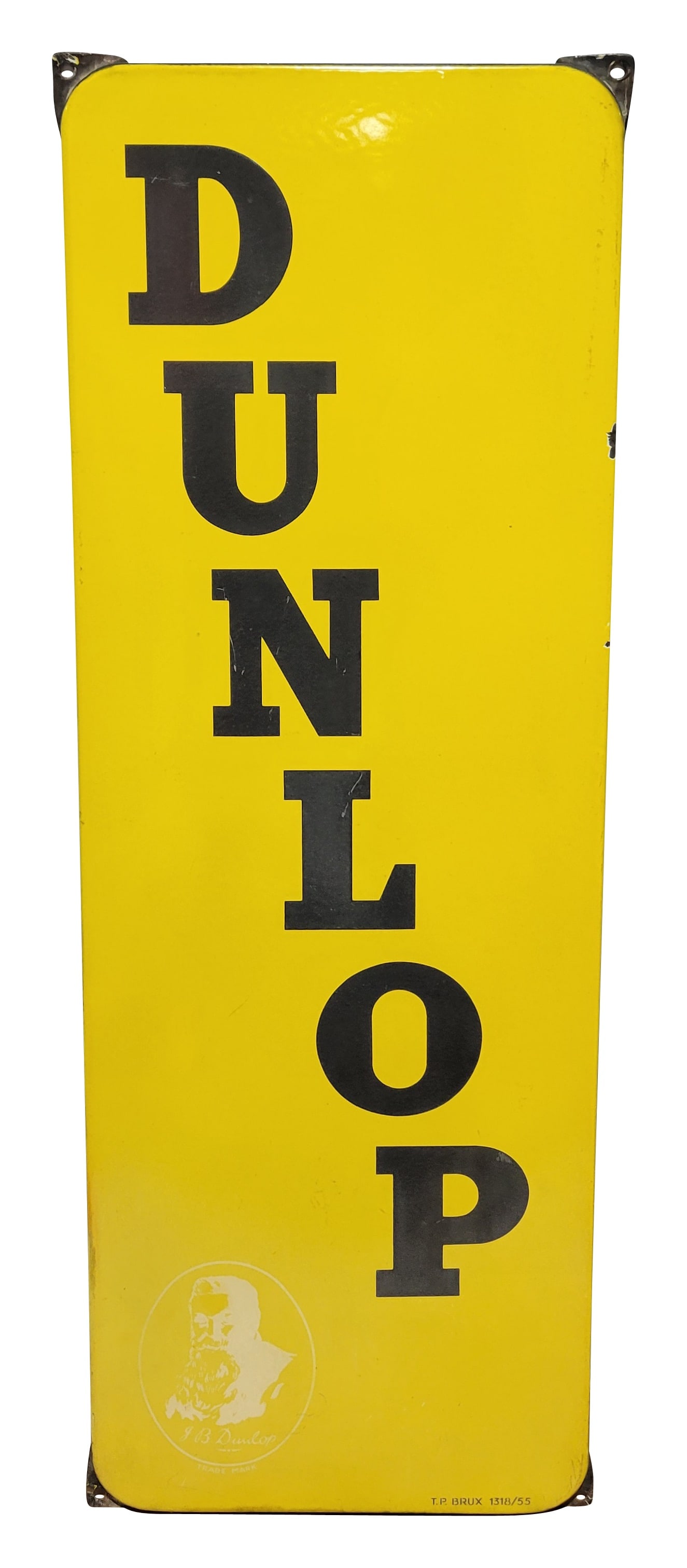 Dunlop Single Sided Porcelain Vertical Sign: 12.5" x 35" single sided porcelain sign features rolled edges and mounting tabs at each corner. The lower left corner has a faded J.B. Dunlop logo. The sign exhibits fading on the black lettering with