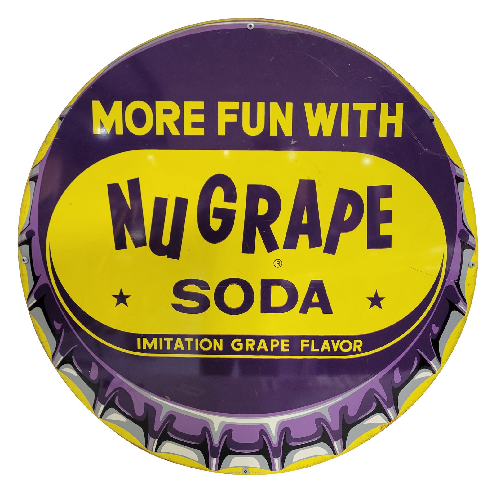 36" More Fun With Nu Grape Soda SST Sign: 36" single sided tin round sign has the Nu Grape bottle cap logo and displays good color and shine with light scratches in the field. The perimeter exhibits wear with light rust and a few minor small 