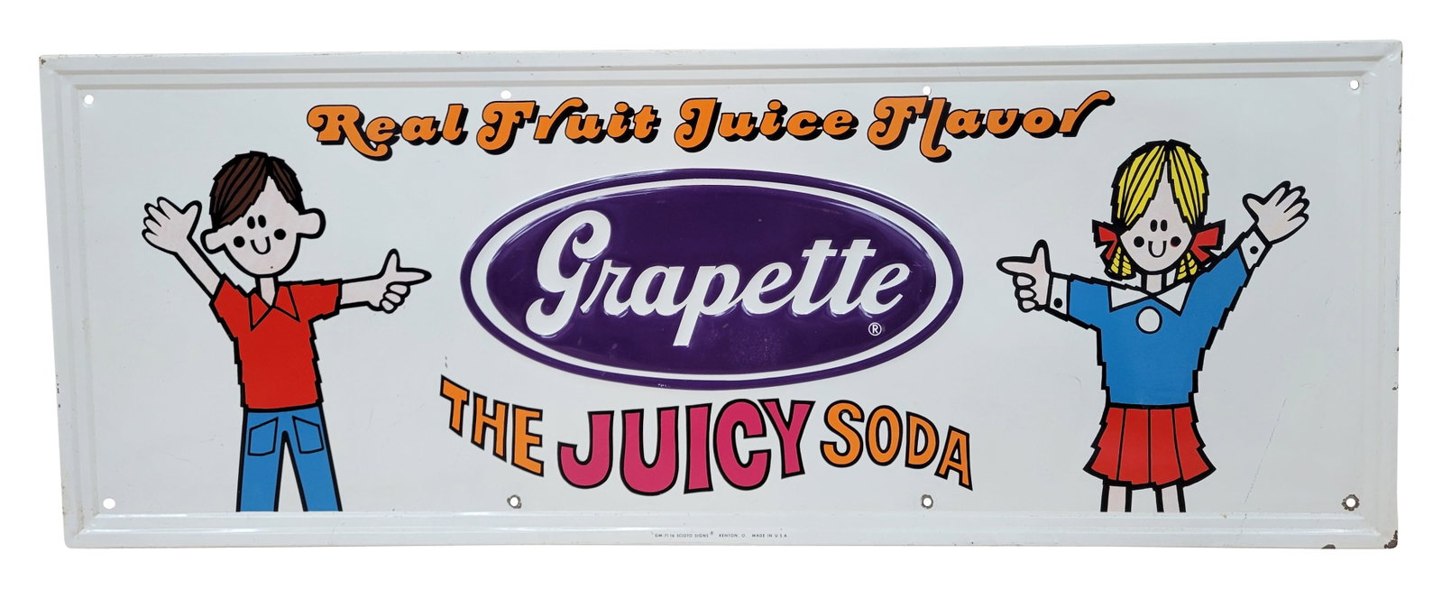 Grapette The Juicy Soda Embossed SST Sign: 31" x 11.5" single sided tin sign exhibits excellent color and good shine throughout with several small scratches and a dull area on the center logo. The self framed perimeter has light wear with flak