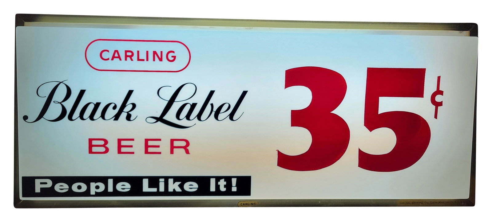 1970's Carling Black Label Beer 35 Cents Light Up Advertising Sign: 24.5" x 10" x 4.5" illuminated sign is in very good working condition. The sign features a plastic face which is in excellent condition and a gold toned housing that exhibits light wear. The sign has