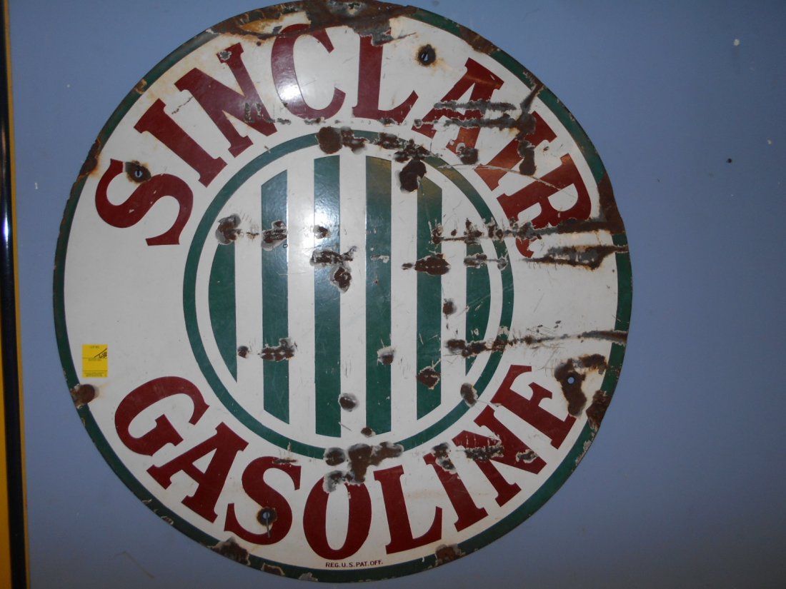 36" Porcelain Sinclair Gasoline Sign: Circa 1920's there are chips and bends in the porcelain. Also a few holes which come in handy for hanging.