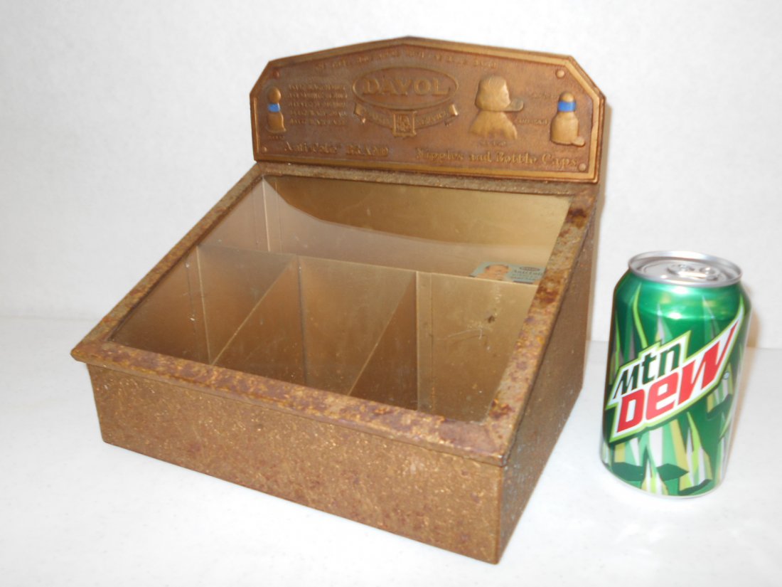 1920's General Store Nipples & Bottle Caps Display: Rare countertop display for Davol nursing nipples and baby bottle caps. Metal with glass top. Embossed Davol metal plate. Glass top lifts to access merchandise. Comes with an empty vintage Davol nippl
